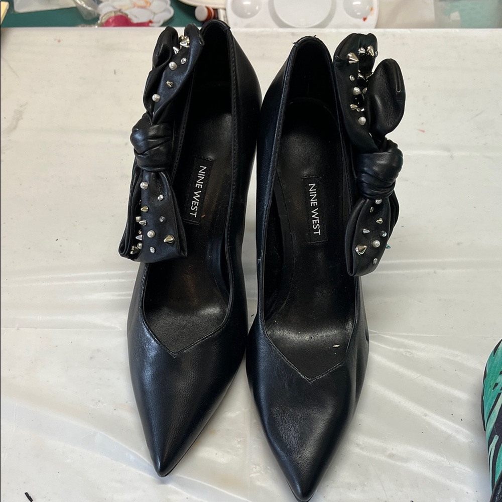 Nine West Black Heels with Studded Bow. Never used. See pics for signs